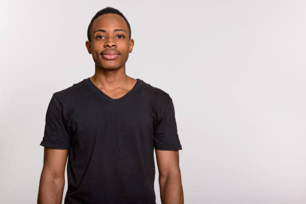 istock Young handsome African man against gray background 668641380