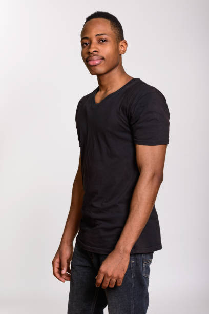 istock Young handsome African man standing against gray background 668641436