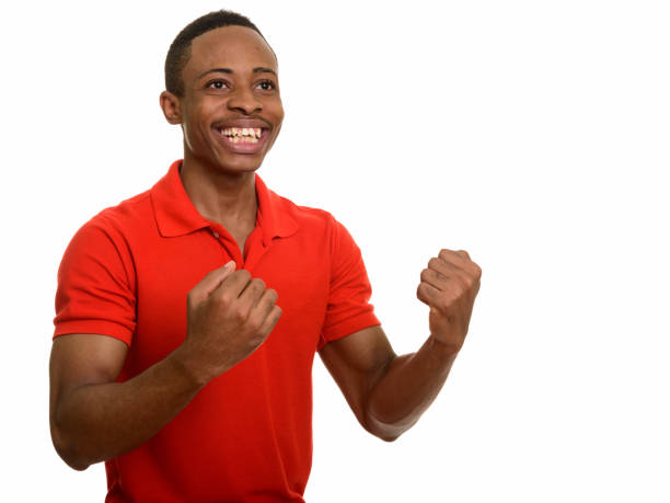 istock Young happy African man smiling and thinking while looking excited 668641596