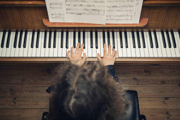 istock piano girl 668650754