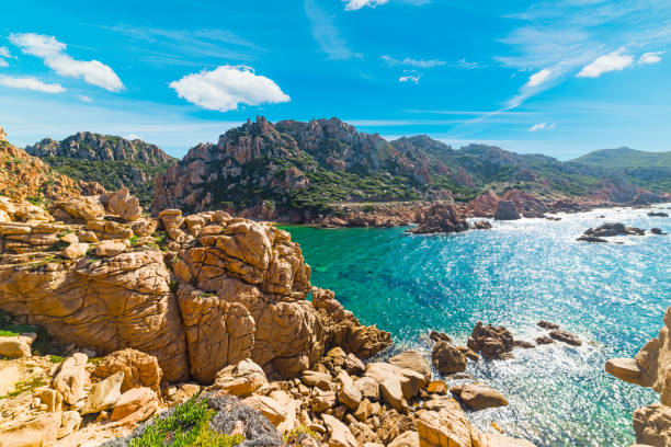 istock yellow rocks and blue sea 668653988
