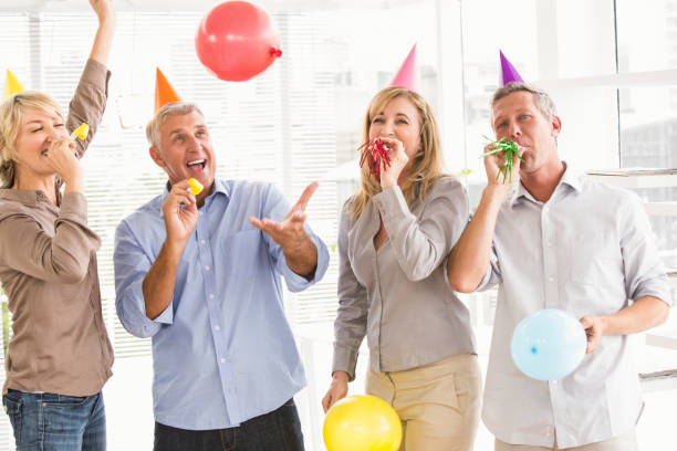 istock Casual business people celebrating birthday 668657758