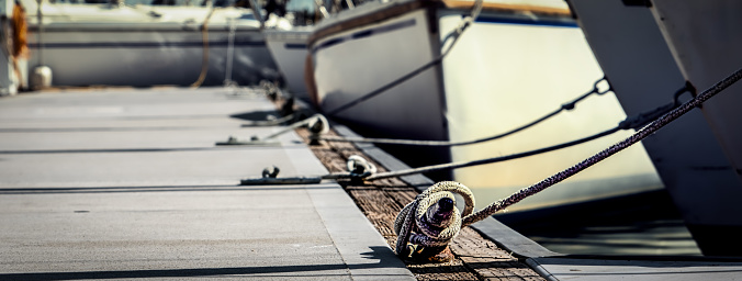Cleats and sailboats at a marina in Coronado, California.