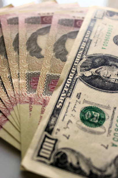 istock a hundred dollars laying on the Ukrainian grivnas 668664496