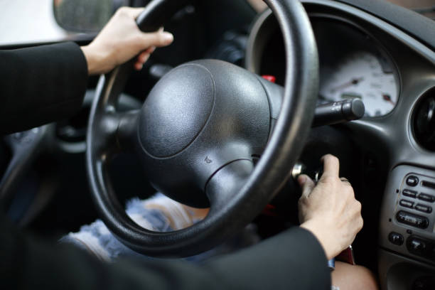 istock Woman hands on car wheel 668667106
