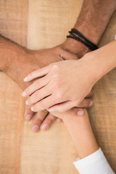 istock Casual business colleagues stacking their hands 668673858