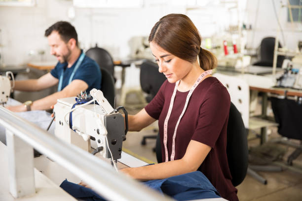 istock Tailors working in a textile factory 668677746