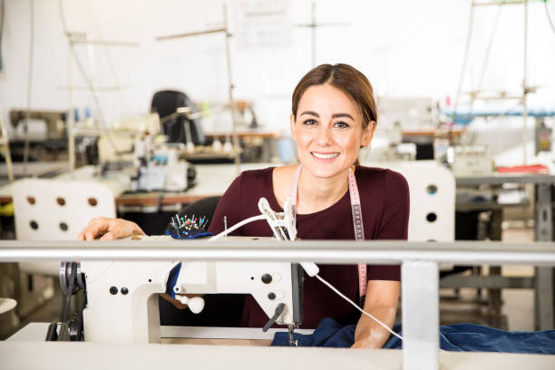 istock Beautiful seamstress enjoying her job 668680496