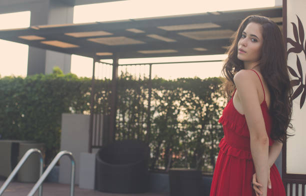 istock Brunette beauty in red 668680566