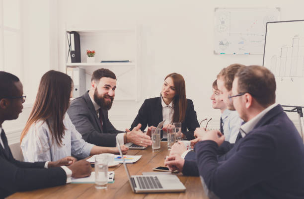 istock Business meeting. Young multiethnic team in modern office 668681646