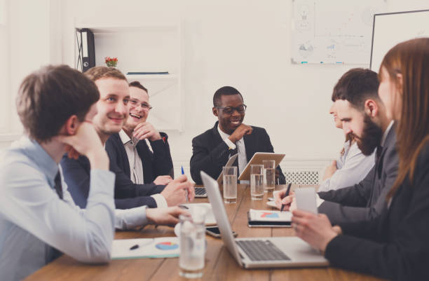 istock Business meeting. Young multiethnic team in modern office 668683874