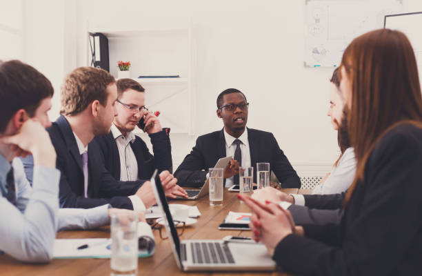 istock Business meeting. Young multiethnic team in modern office 668683936