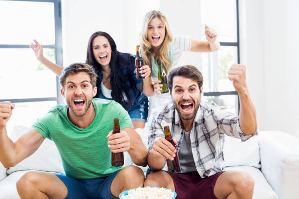 istock Excited friend holding beer bottles 668684142
