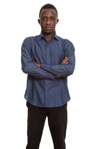 istock Young African man standing with arms crossed 668684328