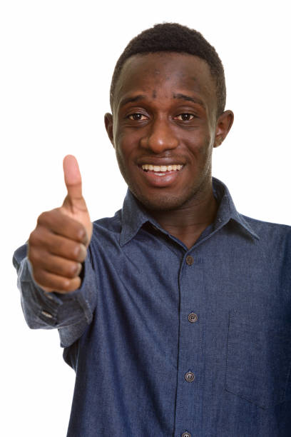 istock Young happy African man smiling and giving thumb up 668684406