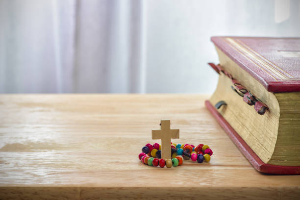 istock Catholic rosary beads and bible 668687436