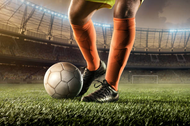 istock soccer player hits a ball 668689160