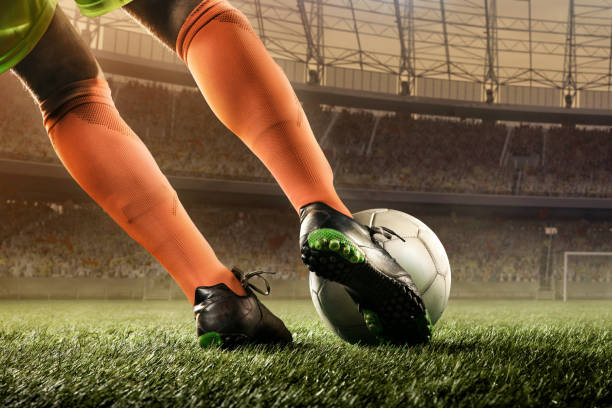istock soccer player hits a ball 668690732