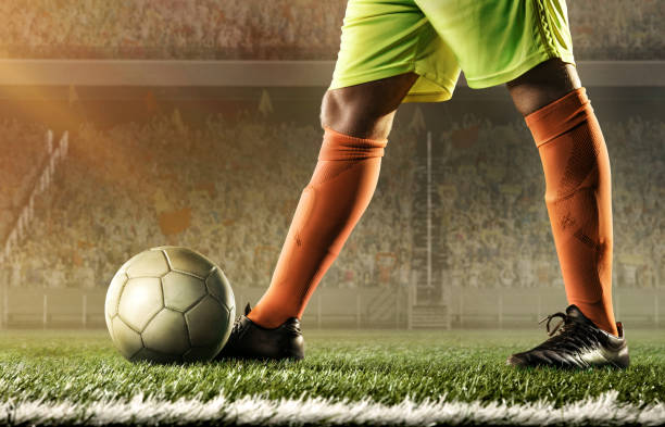 istock soccer player hits a ball 668690854