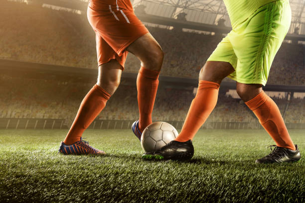 istock soccer players fighting for a ball 668691008