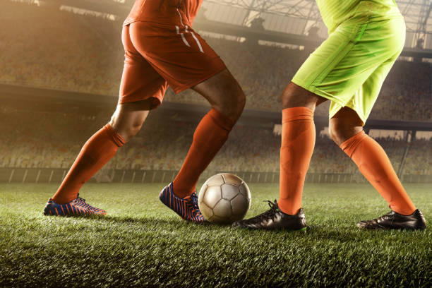 istock soccer players fighting for a ball 668691010