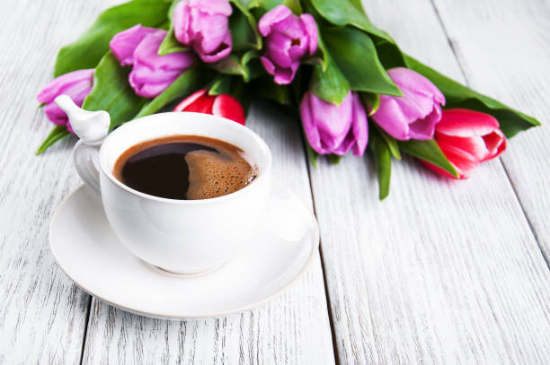 istock cup of coffee with tulips 668691608