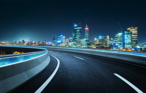 istock Highway overpass modern city skyline background . Night scene . 668691984