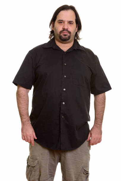 istock Studio shot of overweight bearded man standing 668695392