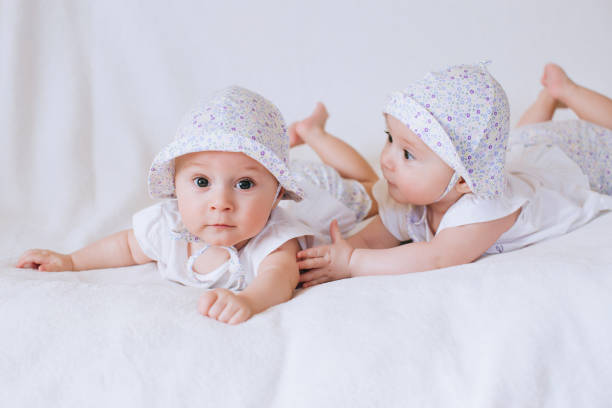 istock Happy twins girls in bed 668697592