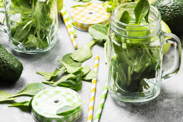 istock Ingredients for green smoothie - apples, spinach, celery, avocado on a light background 668698498