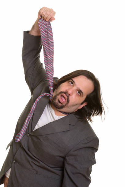 istock overweight bearded businessman pulling his own tie 668701212