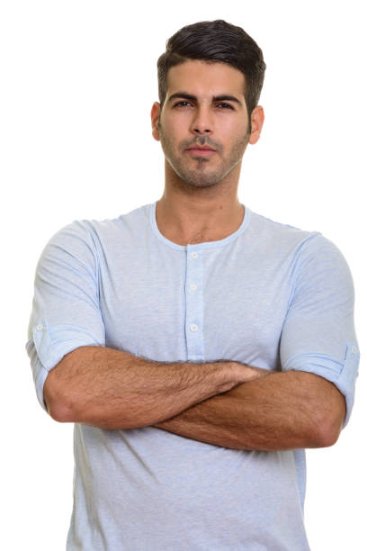 istock Young handsome Persian man with arms crossed 668704776