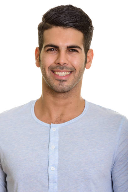 istock Face of young happy Persian man smiling 668704830