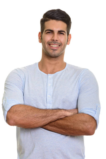 istock Young happy Persian man smiling with arms crossed 668704864