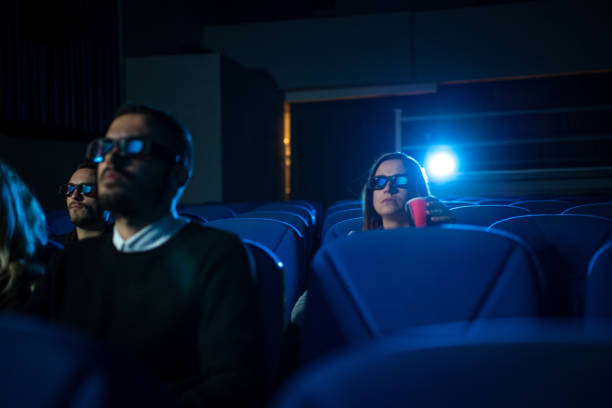 istock Watching a film in cinema 668707538