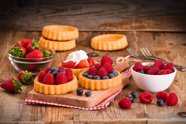 istock Tartlets with forest fruits. 668708228