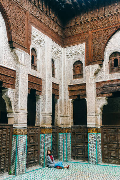 istock Woman sitting inside riad in Morocco 668711078