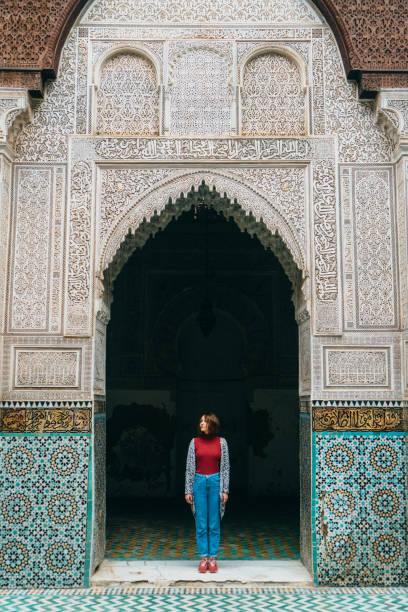 istock Woman standing inside riad in Morocco 668711122