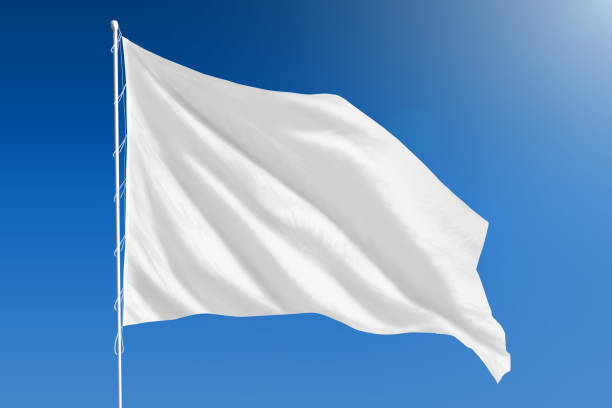 White flag on clear blue sky stock photo