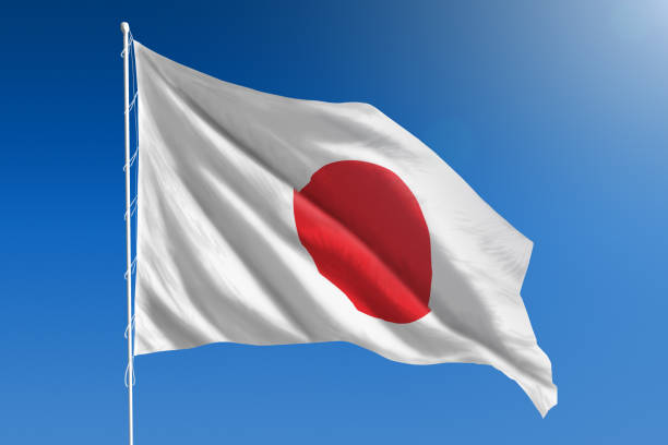 bandera nacional de japón en el claro cielo azul - japanese flag fotos fotografías e imágenes de stock