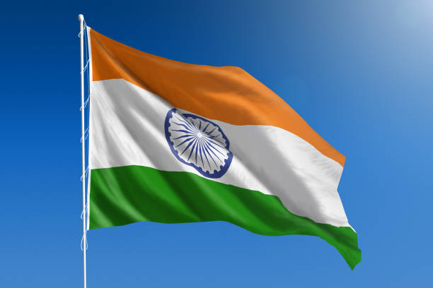 национальный флаг индии на ясном голубом небе - indian flag стоковые фото и изображения