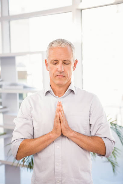 istock Peaceful casual businessman meditating 668712054