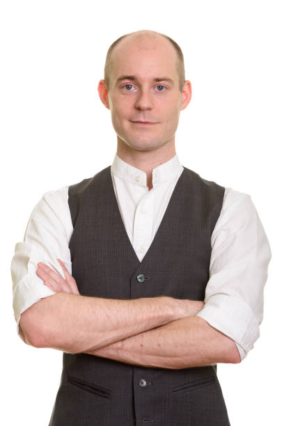 istock Bald handsome businessman with arms crossed 668712090
