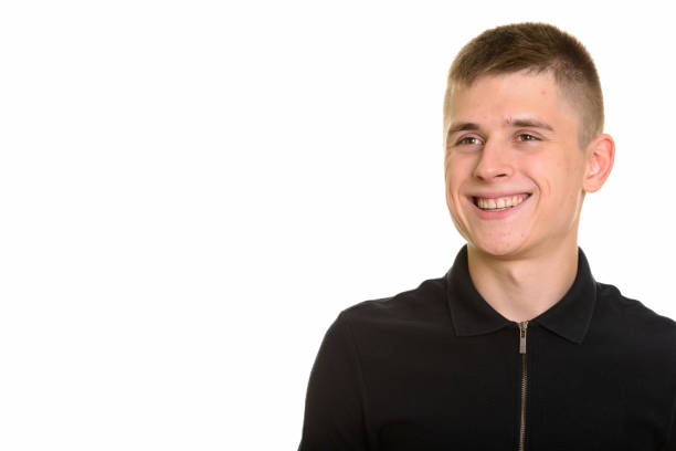 istock Close up of young happy handsome man smiling and thinking 668720754