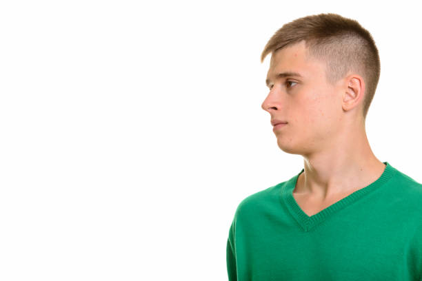istock Close up profile view of young handsome man thinking 668722036