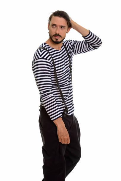 istock Studio shot of handsome man standing and thinking while brushing hair back 668722810