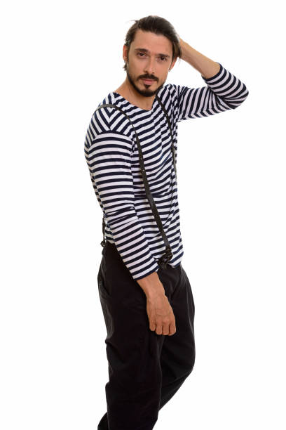 istock Studio shot of handsome man standing and looking at camera while brushing hair back 668722876