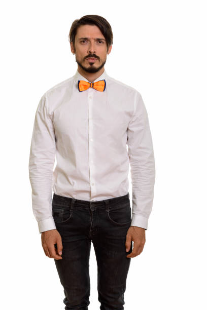 istock Studio shot of handsome man standing while wearing bow tie 668723182
