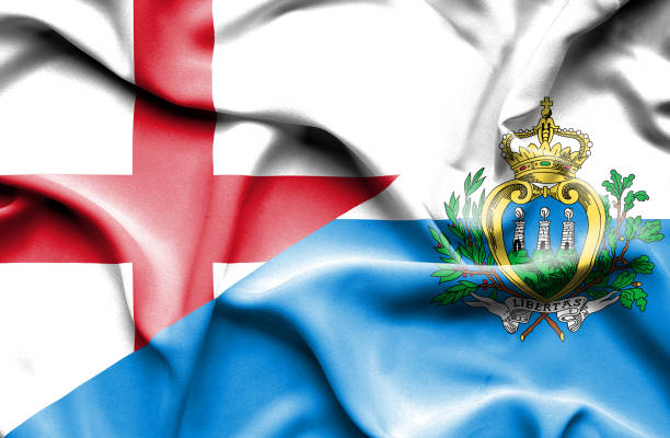 istock Waving flag of San Marino and England 668723916