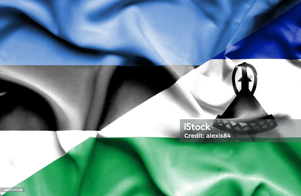 Waving flag of Lesotho and Estonia Agreement stock illustration